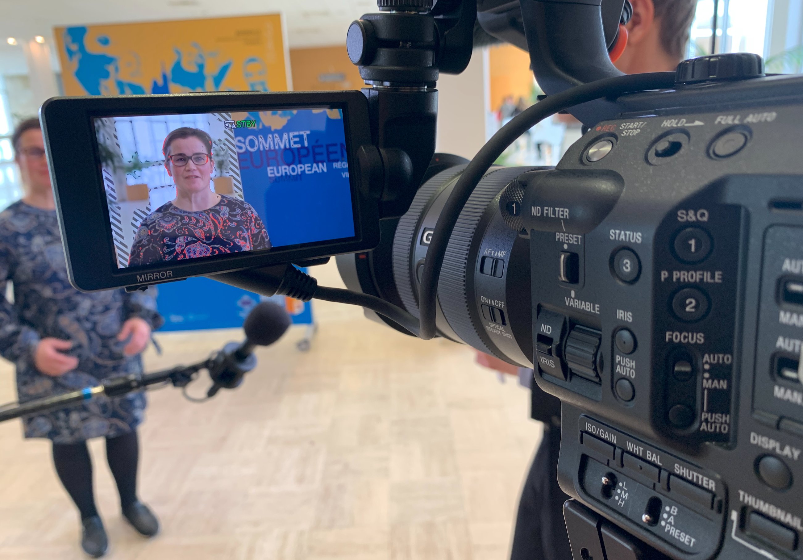 Professional camera framing an EU summit interview — Fullscreen Productions Brussels